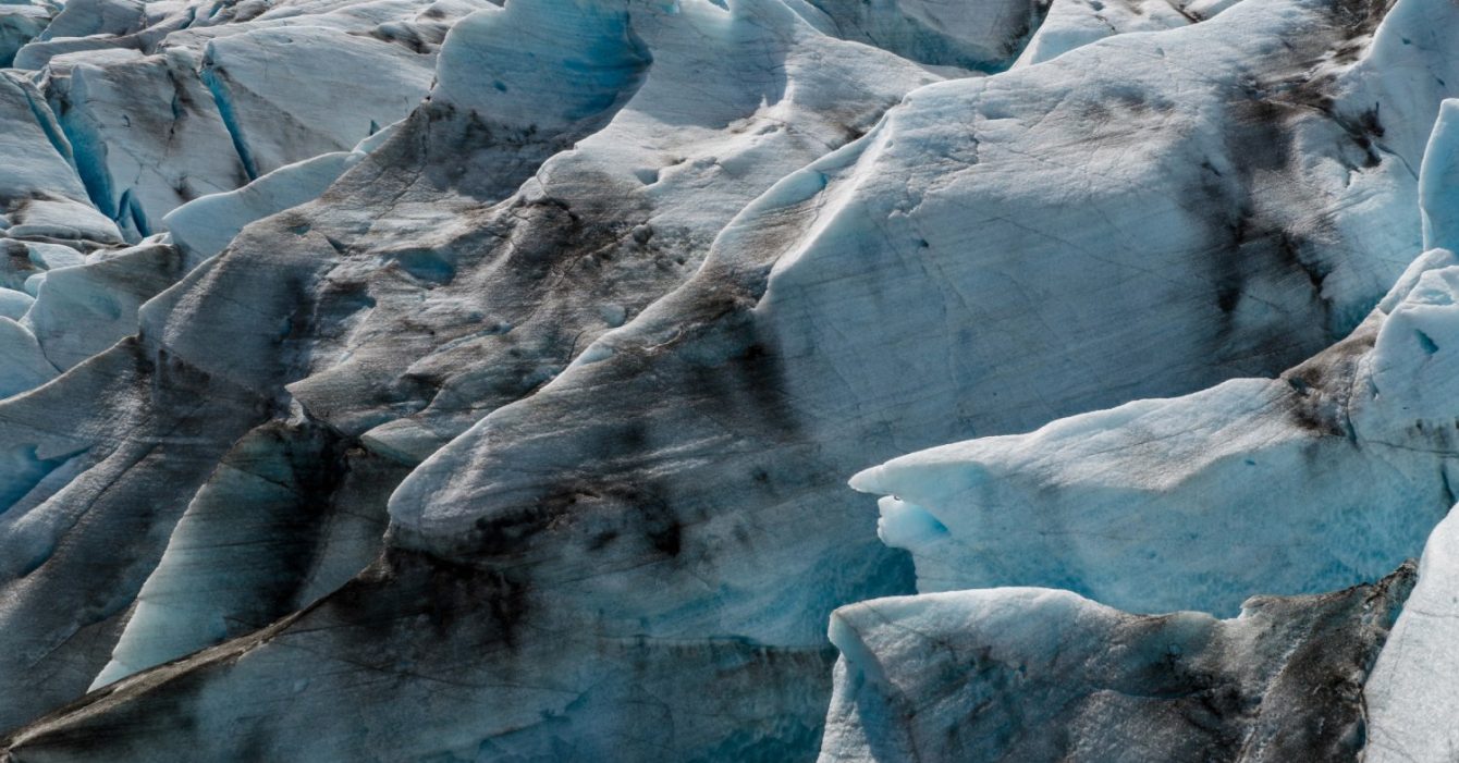 Close-up,Aerial,View,Of,Textured,Glacier,Ice,In,Iceland,,Revealing Close-up,Aerial,View,Of,Textured,Glacier,Ice,In,Iceland,,Revealing