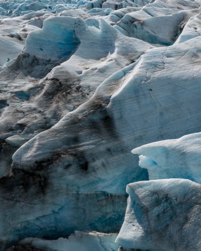 Close-up,Aerial,View,Of,Textured,Glacier,Ice,In,Iceland,,Revealing Close-up,Aerial,View,Of,Textured,Glacier,Ice,In,Iceland,,Revealing